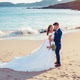 Husband and wife on a beach near the ocean Husband and wife on a beach near the ocean - PhotoDune Item for Sale