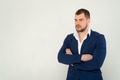 Close up of young business man in a suit with crossed arms on a white background Close up of young business man in a suit with crossed arms on a white background - PhotoDune Item for Sale