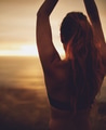 Young woman practicing yoga at sunset Young woman practicing yoga at sunset - PhotoDune Item for Sale