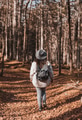 Rear view of girl wearing backpack, hiking in forest in autumn Rear view of girl wearing backpack, hiking in forest in autumn - PhotoDune Item for Sale