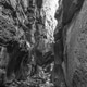 First chockstone on the Rainbow Gorge hiking trail. Monochrome First chockstone on the Rainbow Gorge hiking trail. Monochrome - PhotoDune Item for Sale