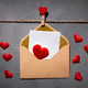 clothespins with red hearts on a rope on a gray background. Background for a postcard clothespins with red hearts on a rope on a gray background. Background for a postcard - PhotoDune Item for Sale