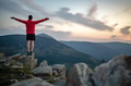Man celebrating sunset looking at view in mountains Man celebrating sunset looking at view in mountains - PhotoDune Item for Sale