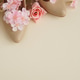 Beige High Heels with Pink Flowers on Cream Background. Festive Spring Fashion Flatlay Beige High Heels with Pink Flowers on Cream Background. Festive Spring Fashion Flatlay - PhotoDune Item for Sale