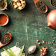 Tea Leaves and Teaware Flat Lay with Rustic Green Background Tea Leaves and Teaware Flat Lay with Rustic Green Background - PhotoDune Item for Sale