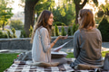 Smiling young two women sitting outdoors in park writing notes Smiling young two women sitting outdoors in park writing notes - PhotoDune Item for Sale