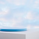 Round blue board display platform on white solid base with soft cloud on bright clear sky background Round blue board display platform on white solid base with soft cloud on bright clear sky background - PhotoDune Item for Sale