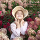 Adorable Little Girl Enjoying Nature Surrounded by Blooming Hydrangeas in a Summer Garden. Adorable Little Girl Enjoying Nature Surrounded by Blooming Hydrangeas in a Summer Garden. - PhotoDune Item for Sale
