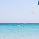 Kitesurf school in the crystal clear sea near the beach of La Cinta, Sardinia. Kitesurf school in the crystal clear sea near the beach of La Cinta, Sardinia. - PhotoDune Item for Sale