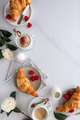 Flat lay of a breakfast table with croissants and coffee Flat lay of a breakfast table with croissants and coffee - PhotoDune Item for Sale