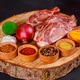 Fresh meat with assorted spices, vegetables displayed on wooden cutting board Fresh meat with assorted spices, vegetables displayed on wooden cutting board - PhotoDune Item for Sale