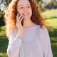 woman with curly red hair talking on mobile phone woman with curly red hair talking on mobile phone - PhotoDune Item for Sale