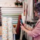 senior woman working in atelier shop with rolls of fabrics. Small business senior woman working in atelier shop with rolls of fabrics. Small business - PhotoDune Item for Sale