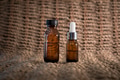 Mock-up amber glass bottles on cane background Mock-up amber glass bottles on cane background - PhotoDune Item for Sale