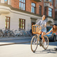 Cute girl on bike pulling friend on skateboard Cute girl on bike pulling friend on skateboard - PhotoDune Item for Sale