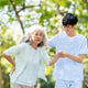 Glasses asian man caregiver nurse helping supporting old woman grandma patient while walking in park Glasses asian man caregiver nurse helping supporting old woman grandma patient while walking in park - PhotoDune Item for Sale