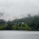 Misty Fjord Village in Norway with Scenic Green Hills Misty Fjord Village in Norway with Scenic Green Hills - PhotoDune Item for Sale