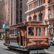 A trolley car is on a street in San Francisco A trolley car is on a street in San Francisco - PhotoDune Item for Sale