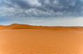 Picturesque desert landscape with dunes and dramatic sky Picturesque desert landscape with dunes and dramatic sky - PhotoDune Item for Sale