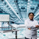 Woman in microchip smart factory using MES software Woman in microchip smart factory using MES software - PhotoDune Item for Sale