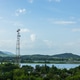 a cell tower for a mobile phone over a rural, forested area in Thailand a cell tower for a mobile phone over a rural, forested area in Thailand - PhotoDune Item for Sale