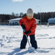Child in winter clothes shoveling snow outdoors Child in winter clothes shoveling snow outdoors - PhotoDune Item for Sale