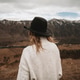 Young woman traveler from back in hat enjoys panoramic view on mountains and Katun river Young woman traveler from back in hat enjoys panoramic view on mountains and Katun river - PhotoDune Item for Sale