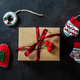 Christmas gift box with hand made felt decoration on dark background Christmas gift box with hand made felt decoration on dark background - PhotoDune Item for Sale