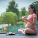 Pregnant woman near swimming pool gently holding her belly Pregnant woman near swimming pool gently holding her belly - PhotoDune Item for Sale