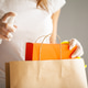 Close up of woman in protective gloves disinfecting shopping Close up of woman in protective gloves disinfecting shopping - PhotoDune Item for Sale