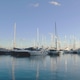 Luxury yachts and sailboat masts reflecting in calm blue water. Abstract nautical background Luxury yachts and sailboat masts reflecting in calm blue water. Abstract nautical background - PhotoDune Item for Sale