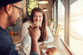 Young couple enjoying a coffee date Young couple enjoying a coffee date - PhotoDune Item for Sale