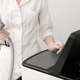 woman in white uniform adjusting laser epilation machine in beauty salon. Body care and cosmetology woman in white uniform adjusting laser epilation machine in beauty salon. Body care and cosmetology - PhotoDune Item for Sale