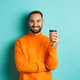 Handsome smiling man taking break, drinking coffee from takeaway, standing over blue background Handsome smiling man taking break, drinking coffee from takeaway, standing over blue background - PhotoDune Item for Sale