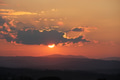 Landscape view of mountains during a sunset in the countryside with the sun behind the clouds. Landscape view of mountains during a sunset in the countryside with the sun behind the clouds. - PhotoDune Item for Sale