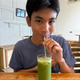 Drinking ice matcha latte. Drinking ice matcha latte. - PhotoDune Item for Sale