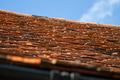 Roof of an English cottage features orange slate tiles Roof of an English cottage features orange slate tiles - PhotoDune Item for Sale