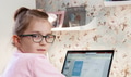 Little girl in eyeglasses doing homework on laptop during lockdown Little girl in eyeglasses doing homework on laptop during lockdown - PhotoDune Item for Sale