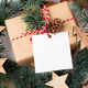 Christmas square gift tag mockup with present box on white background Christmas square gift tag mockup with present box on white background - PhotoDune Item for Sale