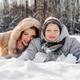 Resting mother with teen son on soft snow, faces close, smiling after winter games. Warm family Resting mother with teen son on soft snow, faces close, smiling after winter games. Warm family - PhotoDune Item for Sale