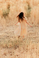 Teenage girl having fun in wheat field. Full length vertical portrait. Summer nature. Yellow color Teenage girl having fun in wheat field. Full length vertical portrait. Summer nature. Yellow color - PhotoDune Item for Sale