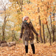 Beautiful adult woman in autumn clothes playing with autumn leaves against the background of autumn Beautiful adult woman in autumn clothes playing with autumn leaves against the background of autumn - PhotoDune Item for Sale