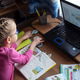 Little girl in eyelgasses watching online lesson on her laptop at home Little girl in eyelgasses watching online lesson on her laptop at home - PhotoDune Item for Sale