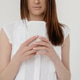 Cropped image of beautiful woman with a long hair writing message on smartphone on white background. Cropped image of beautiful woman with a long hair writing message on smartphone on white background. - PhotoDune Item for Sale