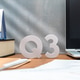 Letters Q3 on a wooden desk alongside a laptop, a book, and a desk calendar. Letters Q3 on a wooden desk alongside a laptop, a book, and a desk calendar. - PhotoDune Item for Sale