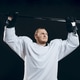 Handsome hockey player. Smiling at camera isolated on black background. Handsome hockey player. Smiling at camera isolated on black background. - PhotoDune Item for Sale
