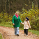 Walking mother with daughter on park path. Holding hands shows parenting, care, trust, safety Walking mother with daughter on park path. Holding hands shows parenting, care, trust, safety - PhotoDune Item for Sale