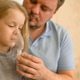 dad helps his sick child do inhalation with a nebulizer at home: he holds a mask from which steam dad helps his sick child do inhalation with a nebulizer at home: he holds a mask from which steam - PhotoDune Item for Sale