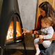 Mother and baby enjoying warmth of cozy fireplace Mother and baby enjoying warmth of cozy fireplace - PhotoDune Item for Sale