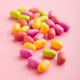 Colorful hard mint Candies on pink background. Colorful hard mint Candies on pink background. - PhotoDune Item for Sale